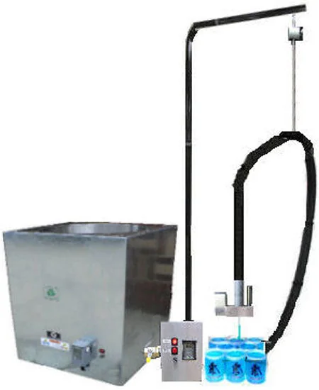 AutoShot automated heated wax filling system with melting tank and pour arm over containers