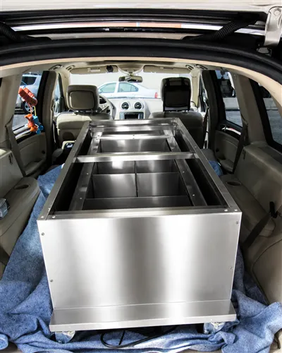 PRIMO Wax Hands X-Press compacted and loaded in the back of an SUV