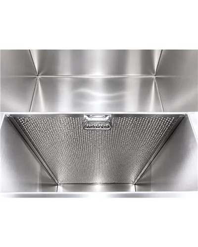 Inside a WaxMelters custom dip tank with a perforated stainless basket at the bottom